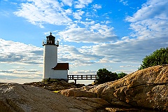 Low Sun Illuminates Rocky Shore By Annisquam Harbor Light